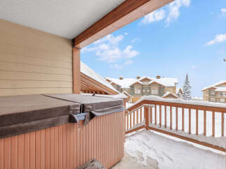 Enjoy the ultimate relaxation in this stunning property featuring a private hot tub, perfect for unwinding after a day on the slopes.
