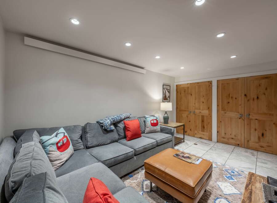 This cozy living room features a comfortable sectional sofa, perfect for relaxing after a long day.
