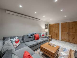 This cozy living room features a comfortable sectional sofa, perfect for relaxing after a long day.