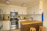 This charming kitchen boasts a modern design with stainless steel appliances and ample cabinet space.