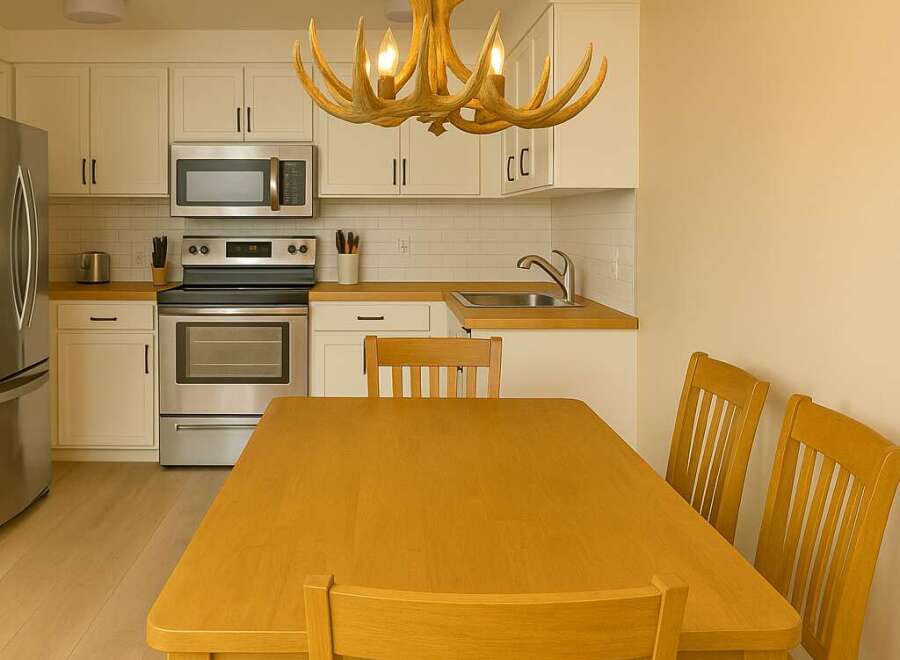This charming kitchen features a warm and inviting dining area, perfect for family meals.
