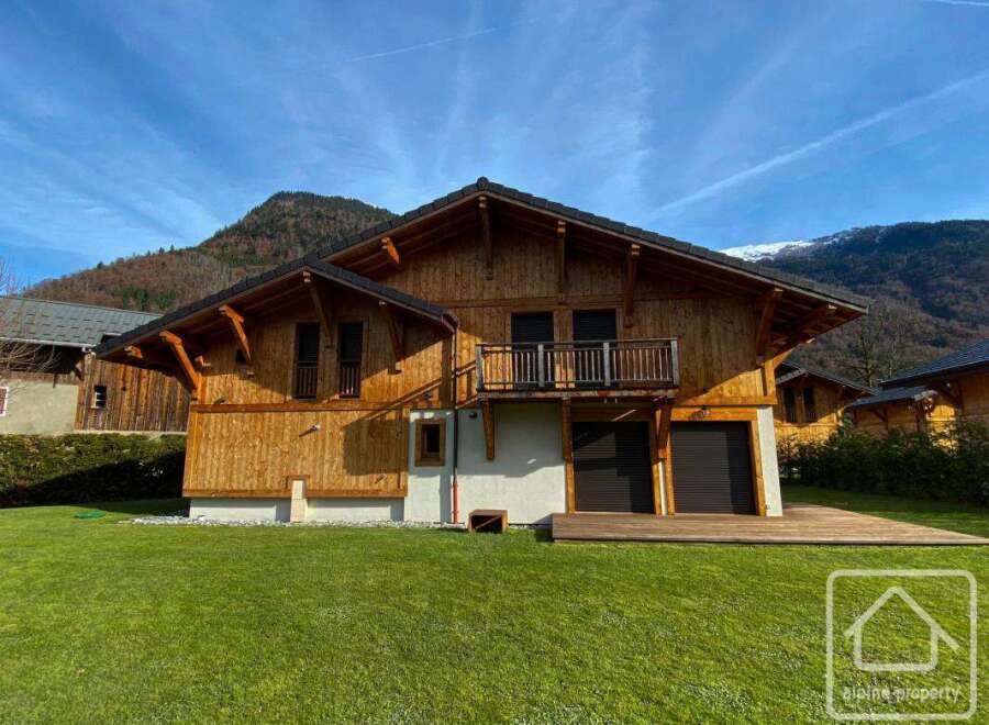 Discover the charm of this stunning wooden chalet nestled in a picturesque mountain setting.