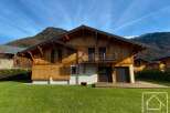 Discover the charm of this stunning wooden chalet nestled in a picturesque mountain setting.
