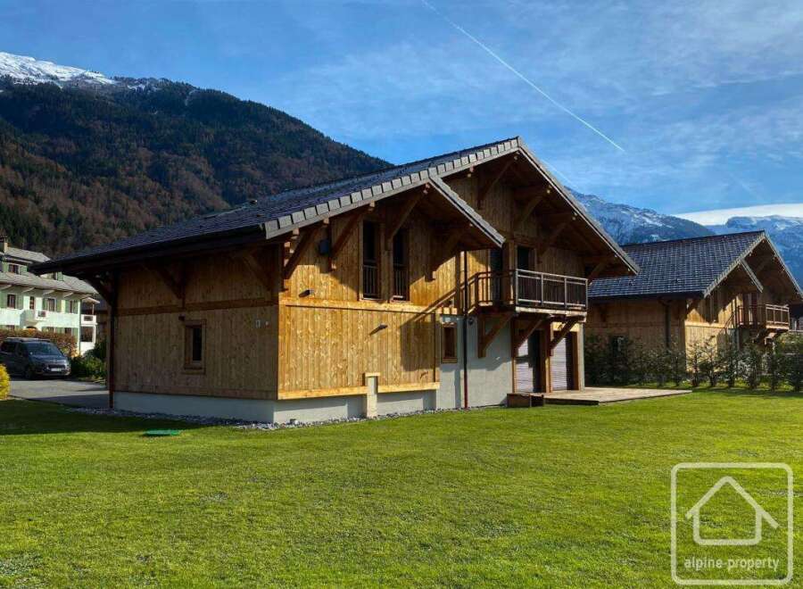 Discover the charm of this stunning wooden chalet nestled in a picturesque mountain setting.