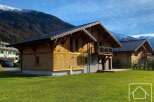 Discover the charm of this stunning wooden chalet nestled in a picturesque mountain setting.
