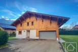 Discover this stunning chalet-style property, boasting a beautiful wooden facade and a modern garage.