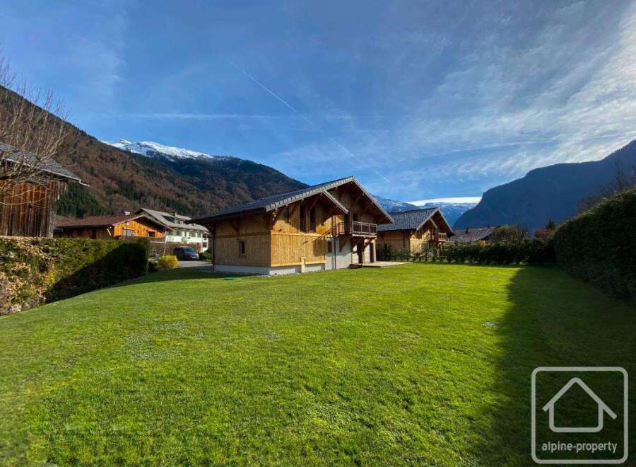 Discover your dream alpine retreat! This stunning property boasts charming wooden chalets, perfect for a cozy mountain escape.