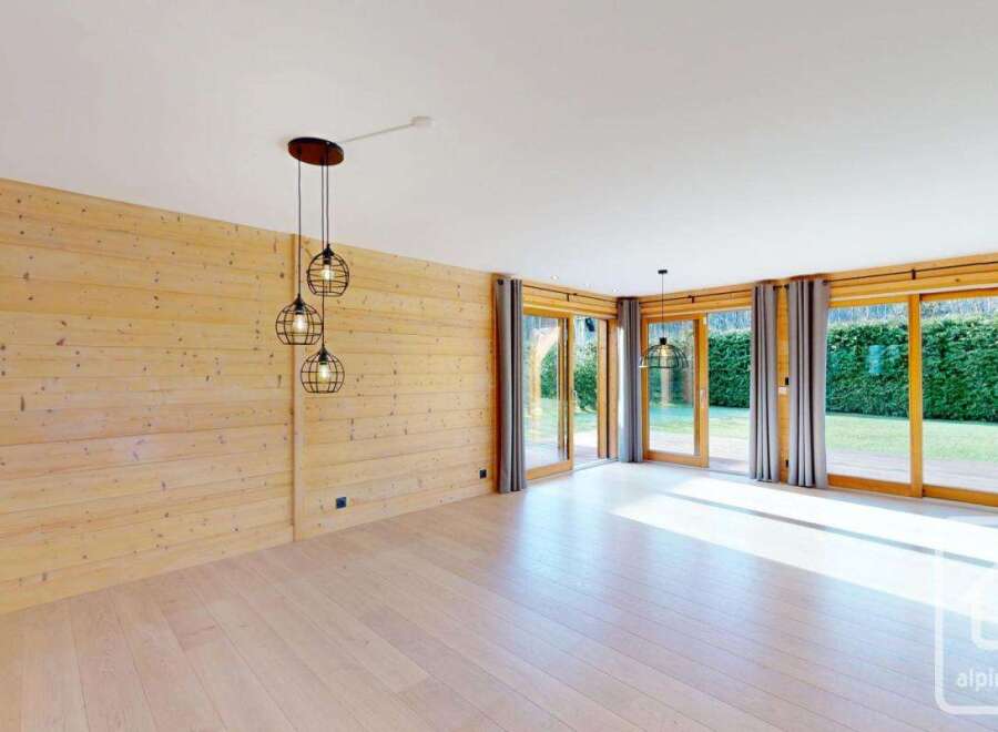 Experience modern living in this stunning property, featuring a bright and airy interior with beautiful wooden accents.