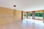 Experience modern living in this stunning property, featuring a bright and airy interior with beautiful wooden accents.