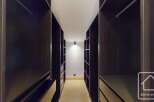 Step into luxury with this stunning walk-in closet, designed for both style and functionality.
