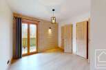 This stunning property boasts a warm and inviting interior with beautiful wooden accents throughout.