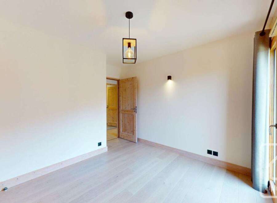 Discover the charm of this inviting property, featuring a bright and airy interior with beautiful wooden accents.