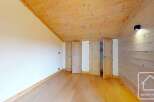 Discover the charm of this inviting space, featuring a warm wooden ceiling and flooring that create a cozy atmosphere.