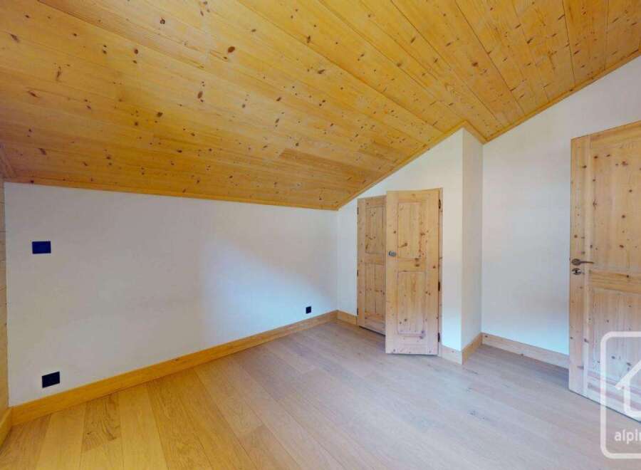 Discover the charm of this inviting property, featuring a beautifully designed interior with wooden accents.