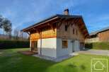 This stunning property showcases a beautiful wooden chalet design, blending seamlessly with its natural surroundings.