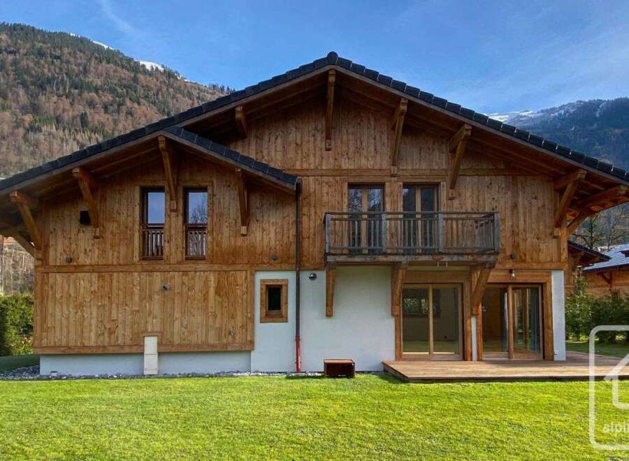 Discover the charm of this stunning wooden chalet nestled in a picturesque mountain setting.