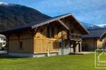 Discover a stunning chalet nestled in a picturesque mountain setting.