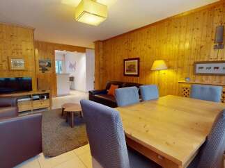 This charming property boasts a warm and inviting living space, perfect for relaxing or entertaining.