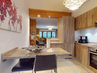 This stunning property boasts a modern kitchen with sleek cabinetry and high-end appliances, perfect for culinary enthusiasts.