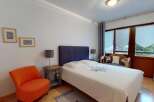 This charming bedroom offers a cozy retreat with its inviting ambiance and stylish decor.