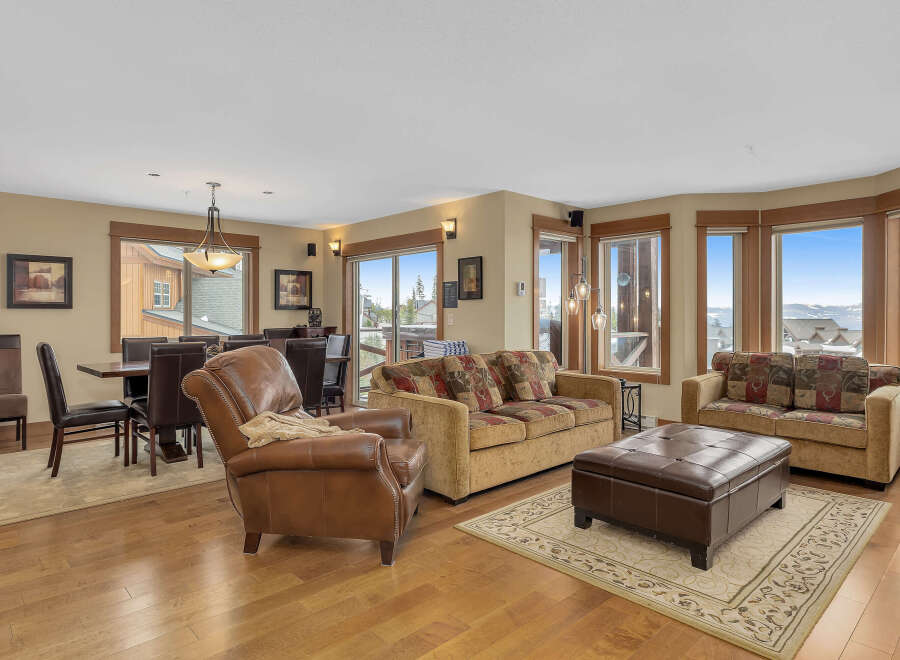 Experience luxury living in this stunning property, featuring a spacious living area with a cozy seating arrangement.