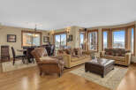 Experience luxury living in this stunning property, featuring a spacious living area with a cozy seating arrangement.