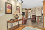 Step into this inviting living space, featuring a warm color palette and stylish decor.
