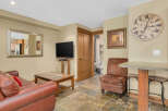 This cozy living space features a comfortable leather sofa, perfect for relaxing.