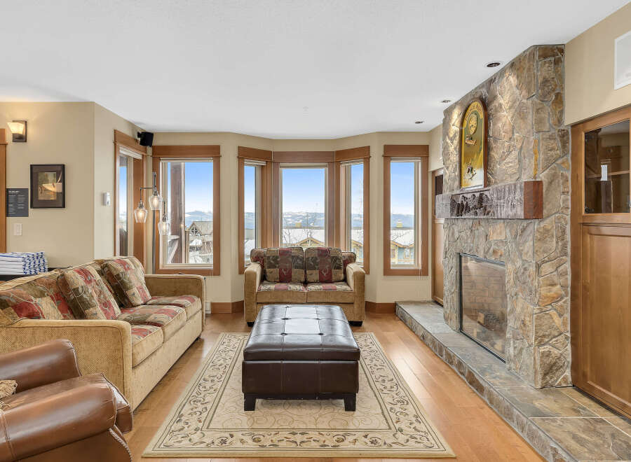 This stunning living room boasts a cozy fireplace, perfect for chilly evenings.
