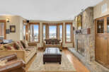 This stunning living room boasts a cozy fireplace, perfect for chilly evenings.