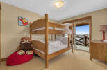 This charming bedroom features a cozy bunk bed, perfect for accommodating guests or family members.