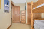 This cozy bedroom features a charming bunk bed, perfect for accommodating guests or family.