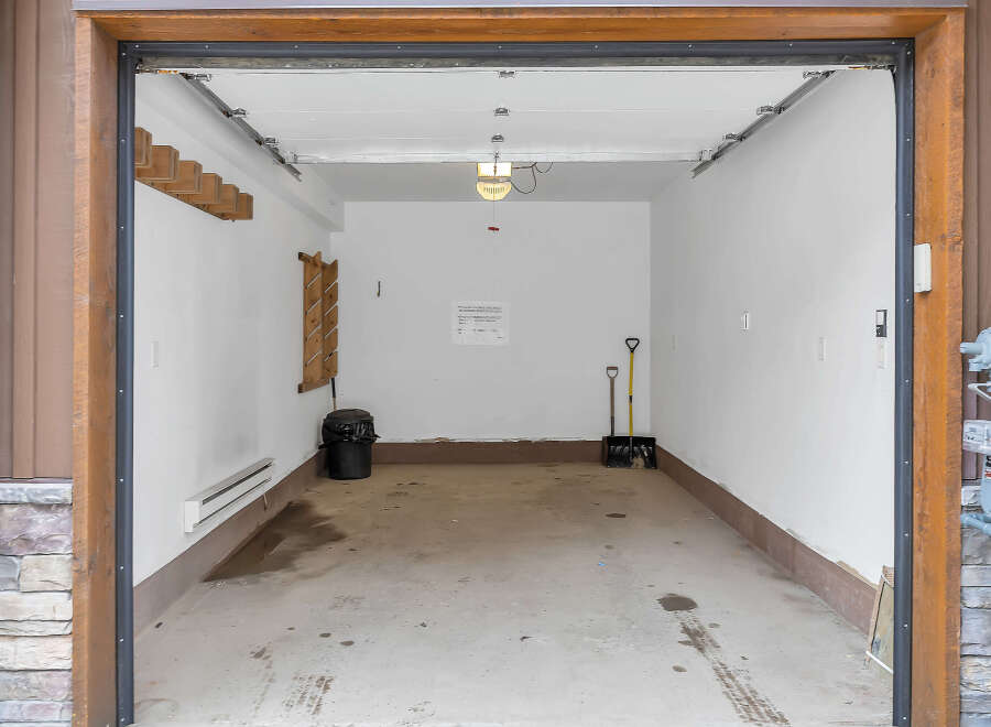 Step inside this spacious garage, perfect for storing vehicles or creating a workshop.