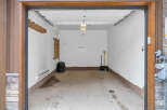 Step inside this spacious garage, perfect for storing vehicles or creating a workshop.