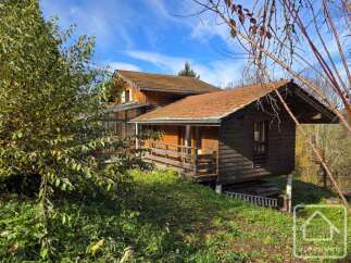 Discover a charming wooden chalet nestled in a serene natural setting.
