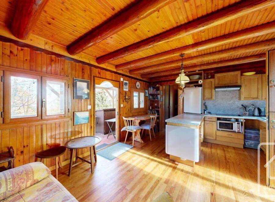 Step into this charming cabin with its warm wooden interior and inviting atmosphere.