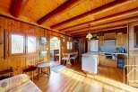 Step into this charming cabin with its warm wooden interior and inviting atmosphere.