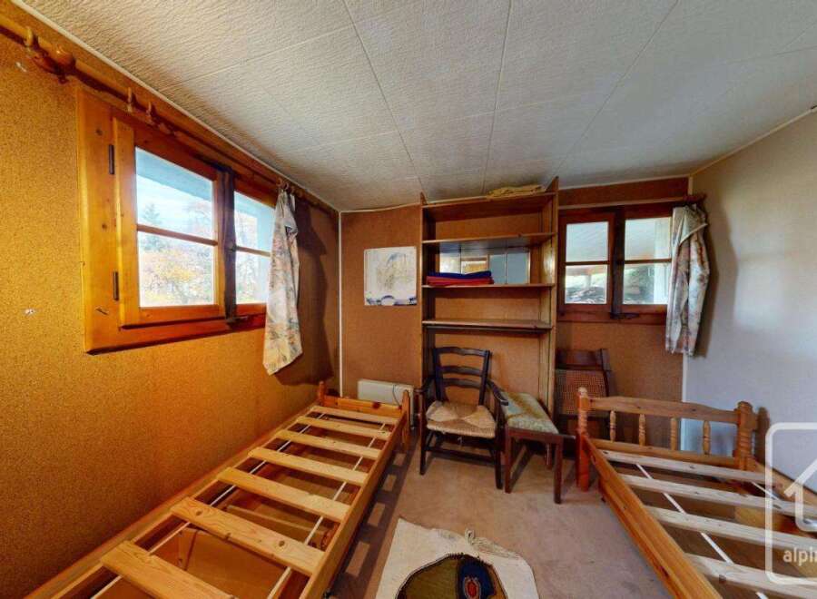 Discover the charm of this cozy bedroom, perfect for a mountain retreat.