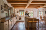 This stunning kitchen boasts a warm and inviting atmosphere, perfect for culinary creations and family gatherings.