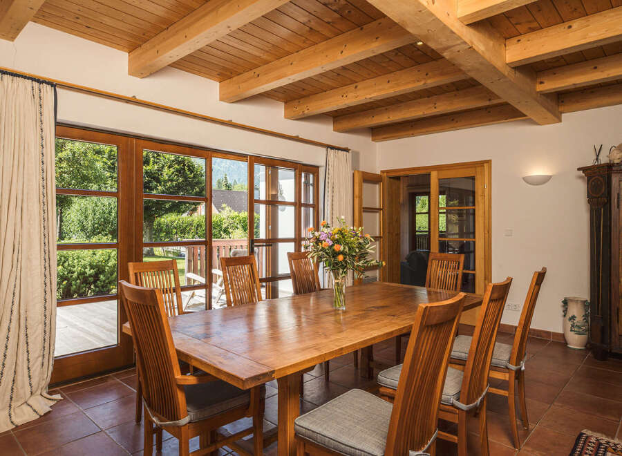 This stunning dining room boasts a warm and inviting atmosphere, perfect for entertaining.