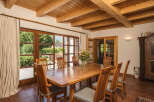 This stunning dining room boasts a warm and inviting atmosphere, perfect for entertaining.