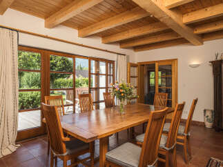 This stunning dining room boasts a warm and inviting atmosphere, perfect for entertaining.