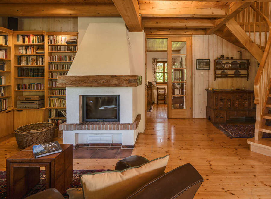 This stunning property boasts a cozy living space with a beautiful fireplace, perfect for relaxing evenings.
