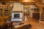 This stunning property boasts a cozy living space with a beautiful fireplace, perfect for relaxing evenings.