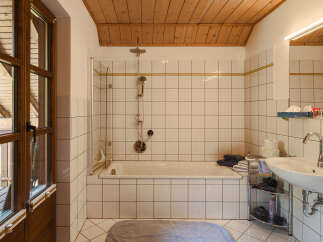 Step into this inviting bathroom, featuring a combination of functionality and style.