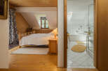 Discover the charm of this inviting bedroom and bathroom combination.