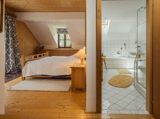Discover the charm of this inviting bedroom and bathroom combination.