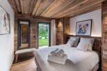 Experience rustic elegance in this stunning bedroom.