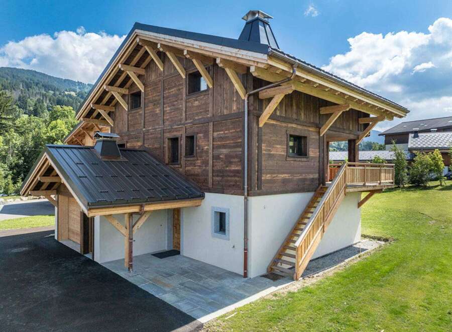 This stunning wooden chalet offers a perfect blend of rustic charm and modern comfort.