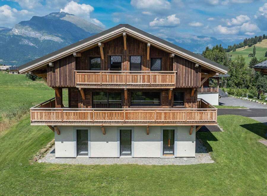 Discover the charm of this stunning wooden chalet nestled in a picturesque mountain setting.